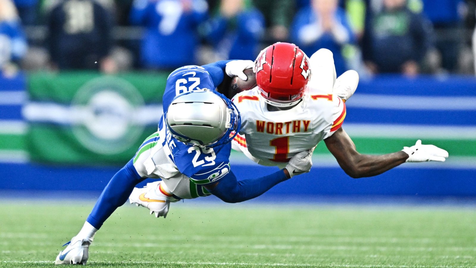 Seattle’s defense challenges Chiefs receiver Xavier Worthy during the October 25 game.