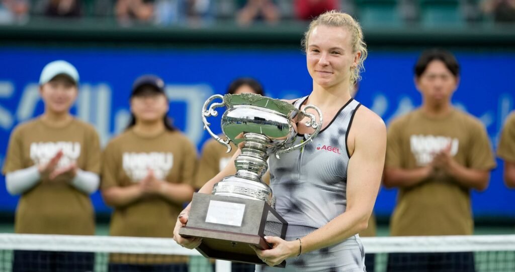 Katerina Siniakova holds the Japan Open trophy at the title ceremony in Osaka on October 25, 2026.