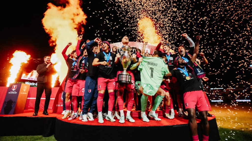 St. Louis CITY players celebrate with the U.S. Open Cup trophy amid confetti.