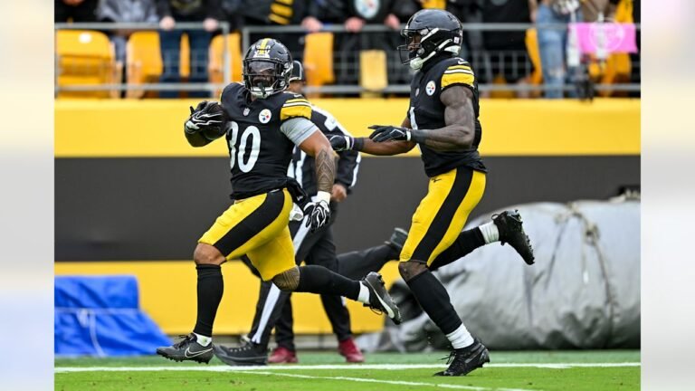 Jaylen Warren runs with the ball in a black Pittsburgh Steelers uniform during the October 11 game against Indianapolis.