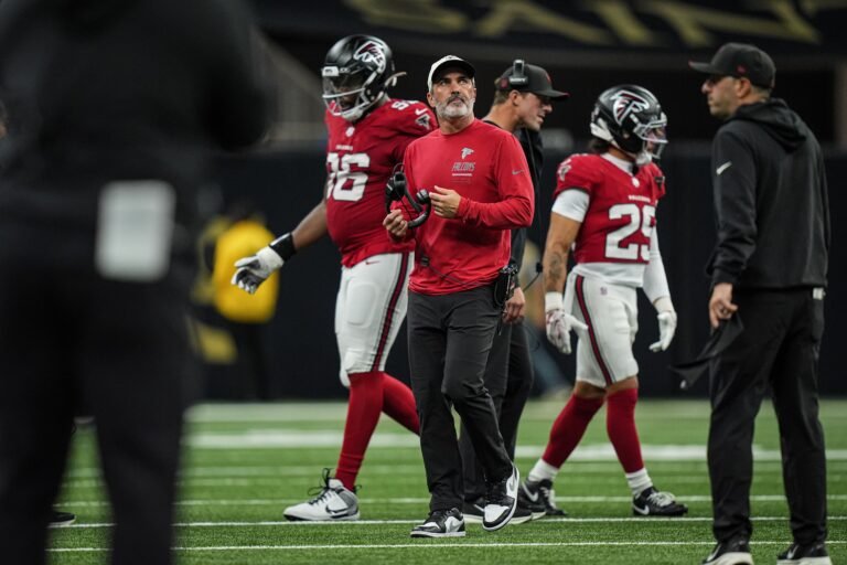 Falcons head coach Kevin Stefanski holds his headset during the game against New Orleans.