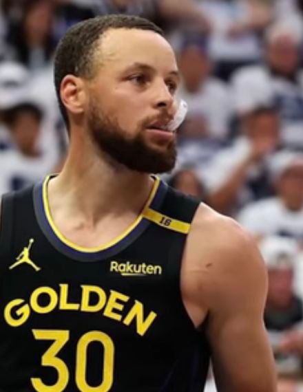 Stephen Curry in a black Golden State Warriors number 30 uniform.