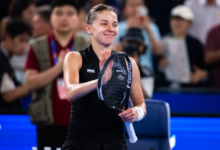 Maja Chwalinska smiles and applauds the crowd after her Wuhan semifinal victory.