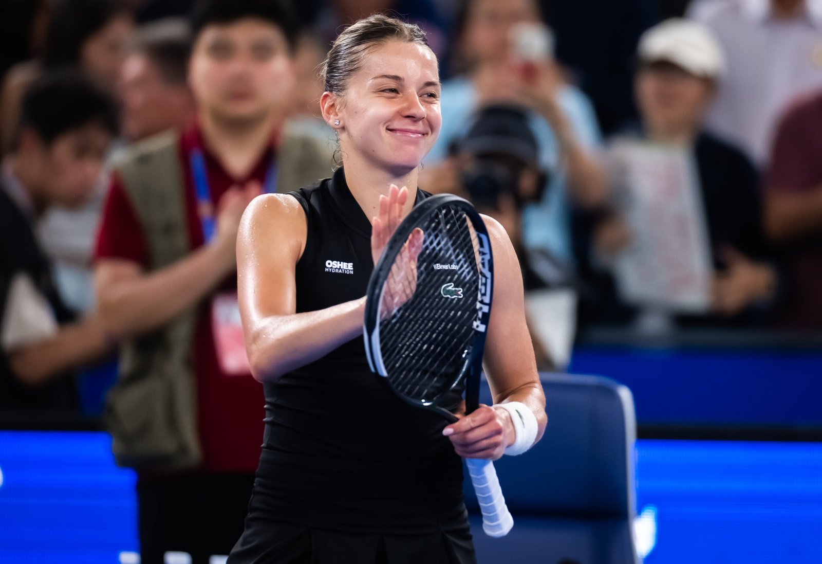 Maja Chwalinska smiles and applauds the crowd after her Wuhan semifinal victory.