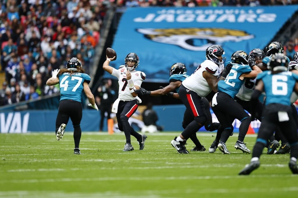 C.J. Stroud throws as Houston’s offensive line blocks against Jacksonville at Wembley Stadium.
