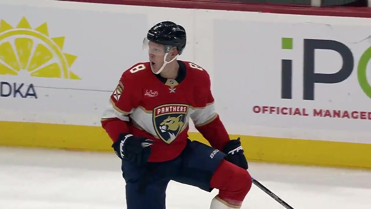 Brady Tkachuk in Florida’s red No. 8 jersey celebrating against Vancouver.
