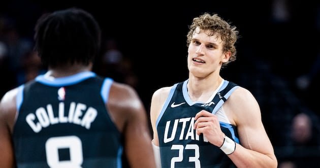 Lauri Markkanen and Isaiah Collier in Utah Jazz uniforms during a game.