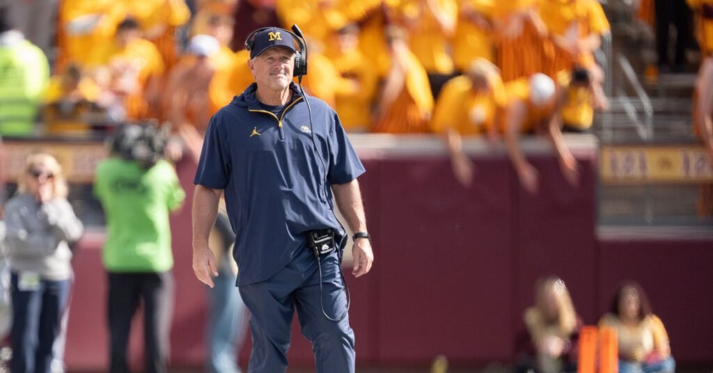Kyle Whittingham watches Michigan’s game at Minnesota.