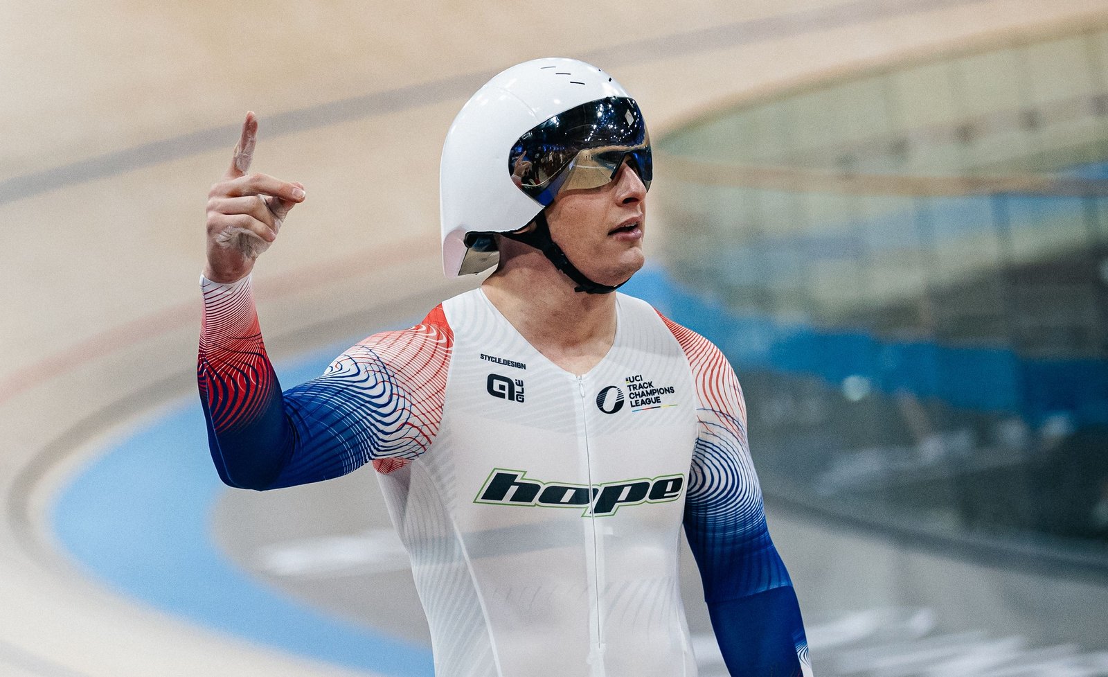Matthew Richardson celebrates at a track cycling event.