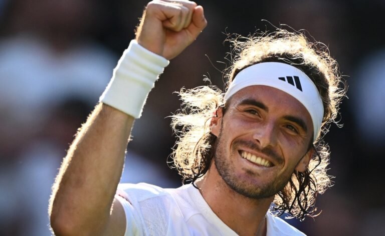 Stefanos Tsitsipas raises his fist in celebration.