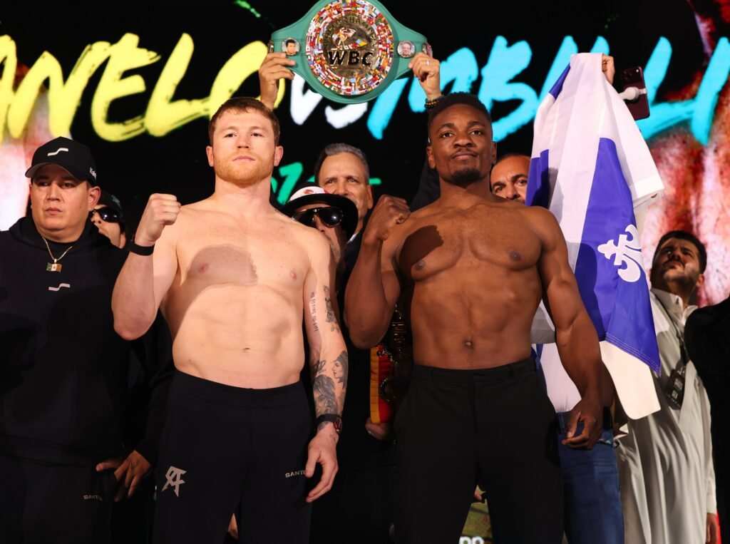 Álvarez and Mbilli pose with raised fists at the weigh-in.