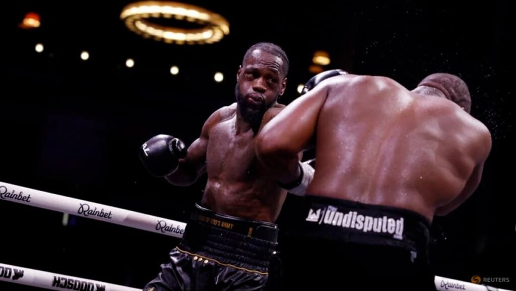 Wilder exchanges punches with Chisora near the ropes.