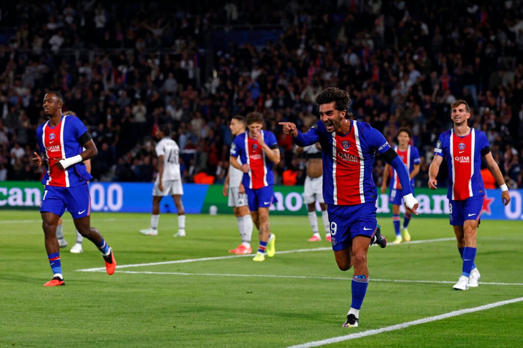 PSG players celebrate on the field during their September 9 Champions League match against Slovan Bratislava.