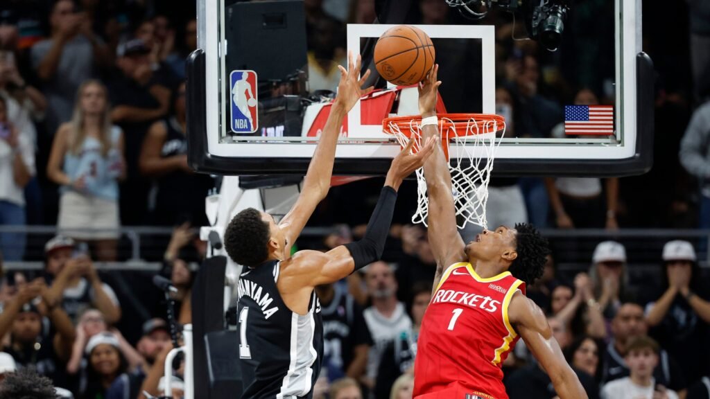 Amen Thompson challenges Victor Wembanyama at the basket during Rockets–Spurs in Austin.