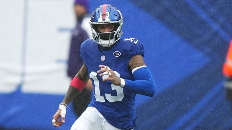 Odell Beckham Jr. running in a blue New York Giants uniform.