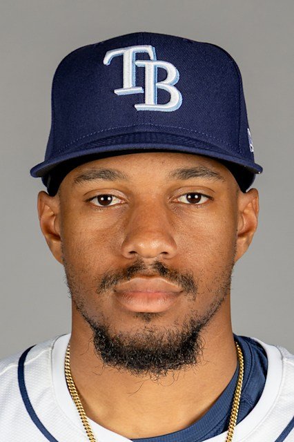 Chandler Simpson wearing a Tampa Bay Rays cap and white jersey in an official player portrait.