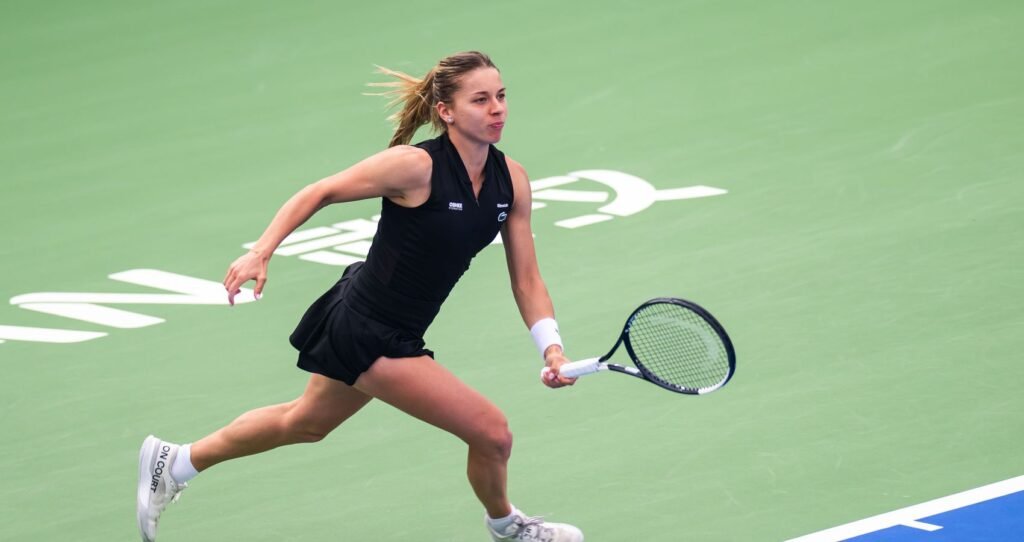 Maja Chwalińska prepares a backhand on a green hard court at the 2026 Wuhan Open.