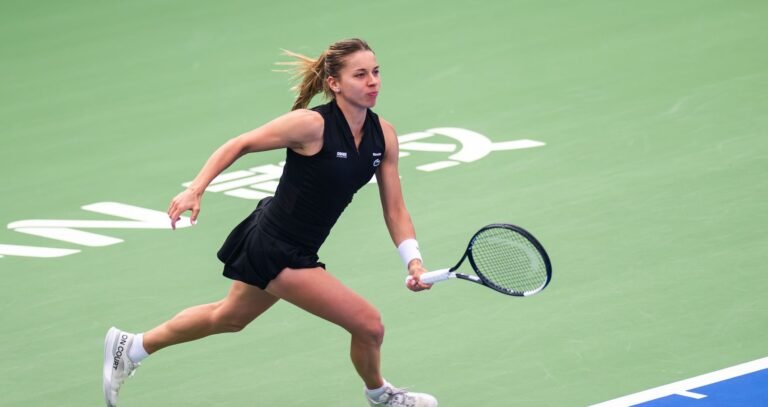 Maja Chwalińska prepares a backhand on a green hard court at the 2026 Wuhan Open.