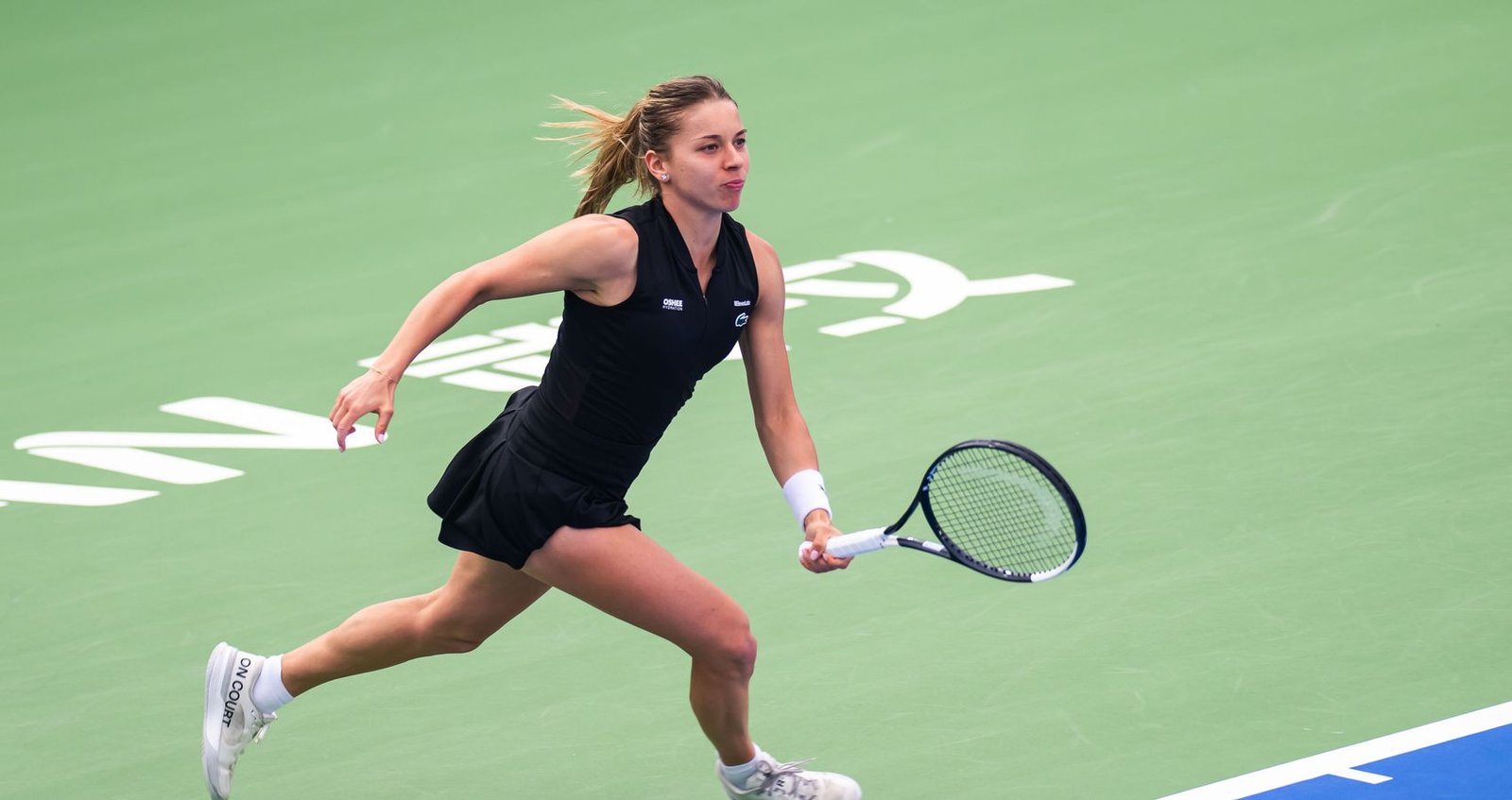 Maja Chwalińska prepares a backhand on a green hard court at the 2026 Wuhan Open.