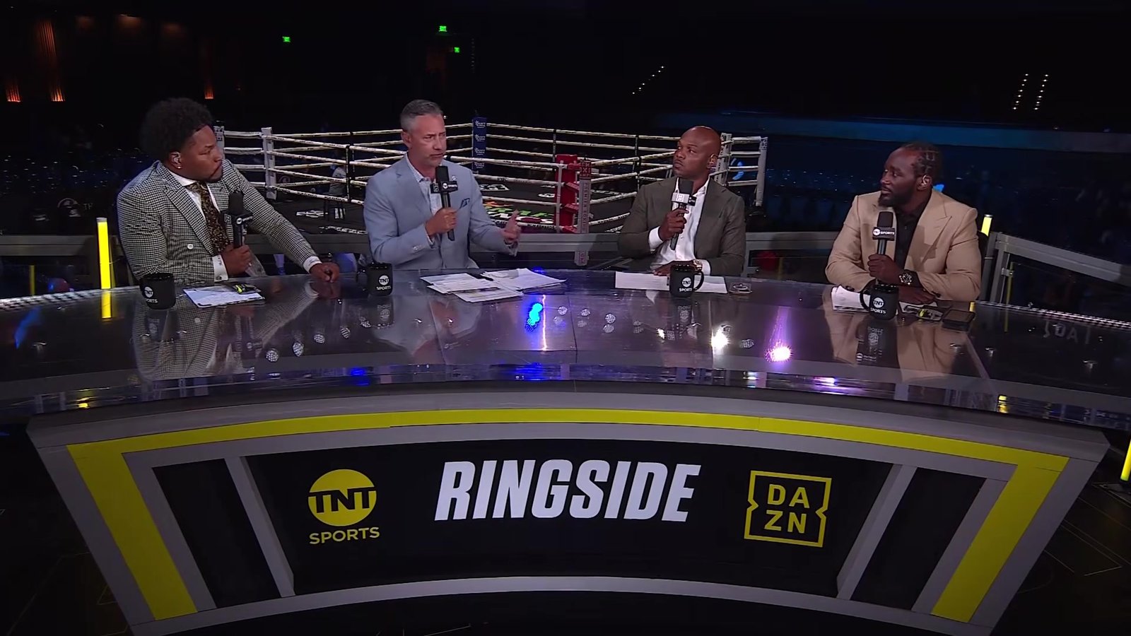 Four The Fight presenters at a ringside desk branded TNT Sports and DAZN.