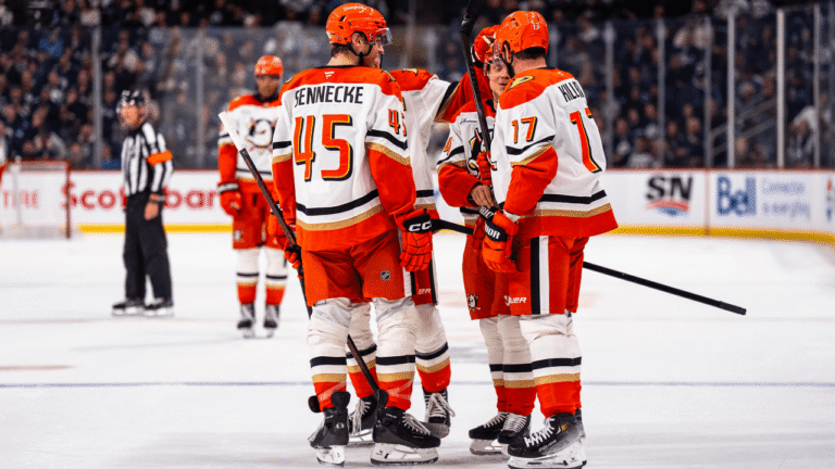 Anaheim Ducks players celebrate during their October 9 game against the Winnipeg Jets