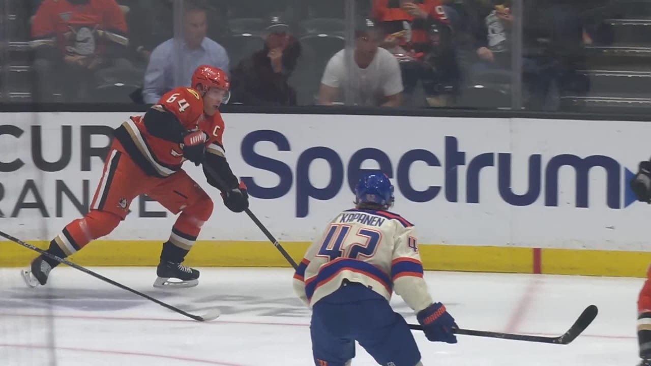 Mikael Granlund controls the puck with an Edmonton skater in front of him during Anaheim’s October 7 game against the Oilers