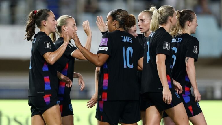 England players celebrating together during the first-leg win against Greece