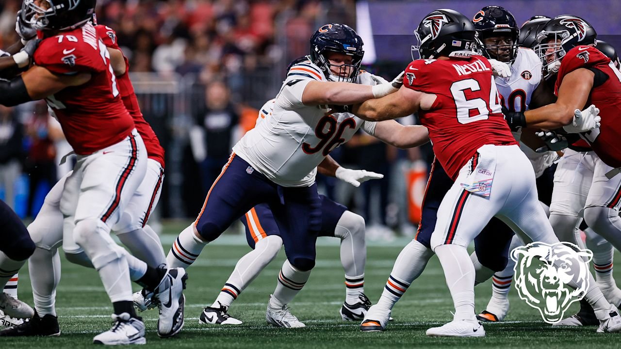 Falcons center Ryan Neuzil blocks a Bears defender.
