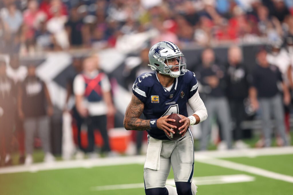 Dak Prescott holding the football during Dallas&rsquo; October 4, 2026 game against Houston.