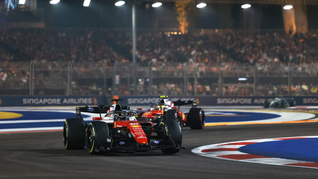 Charles Leclerc leads Lewis Hamilton in their Ferraris at Singapore