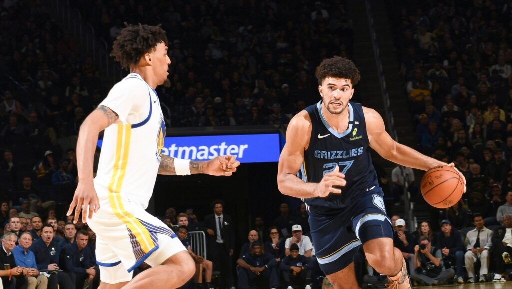 Cameron Boozer dribbles for Memphis against a Golden State defender.