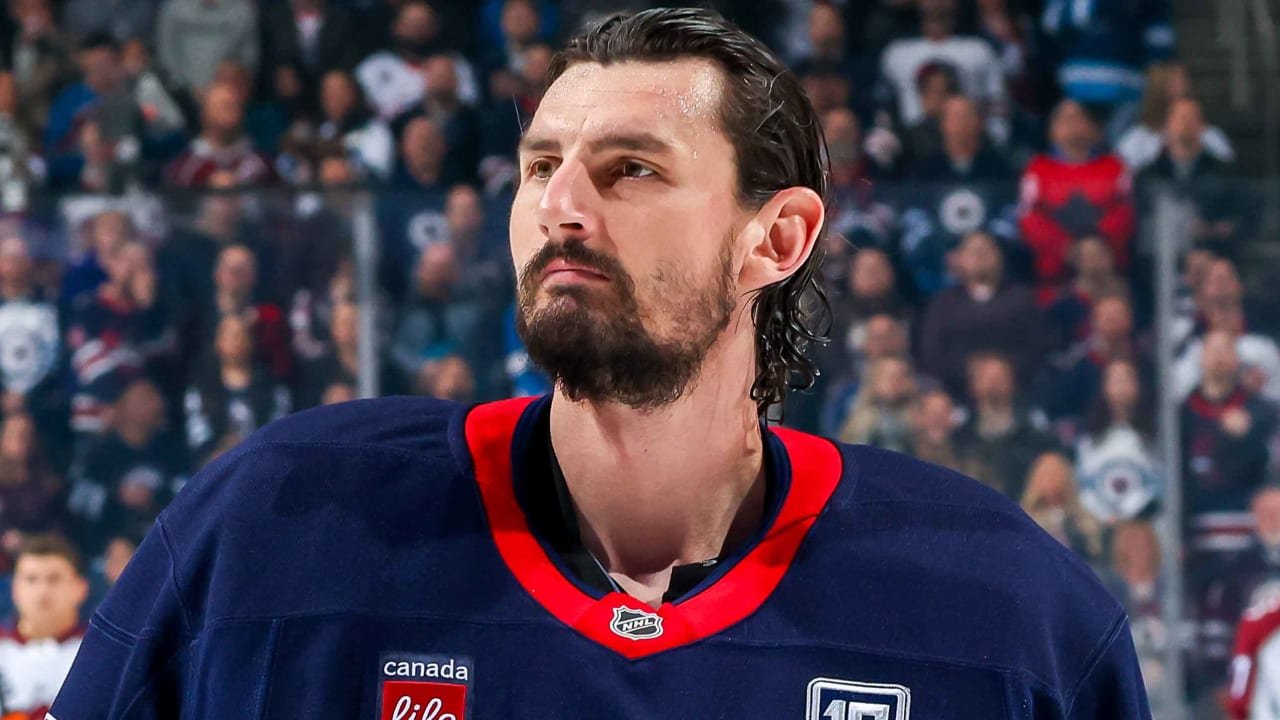 Connor Hellebuyck in a Winnipeg Jets jersey, shown in an archival photograph.