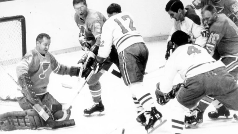 Glenn Hall guards the St. Louis Blues’ goal as players gather in front of the crease in an archival photograph.
