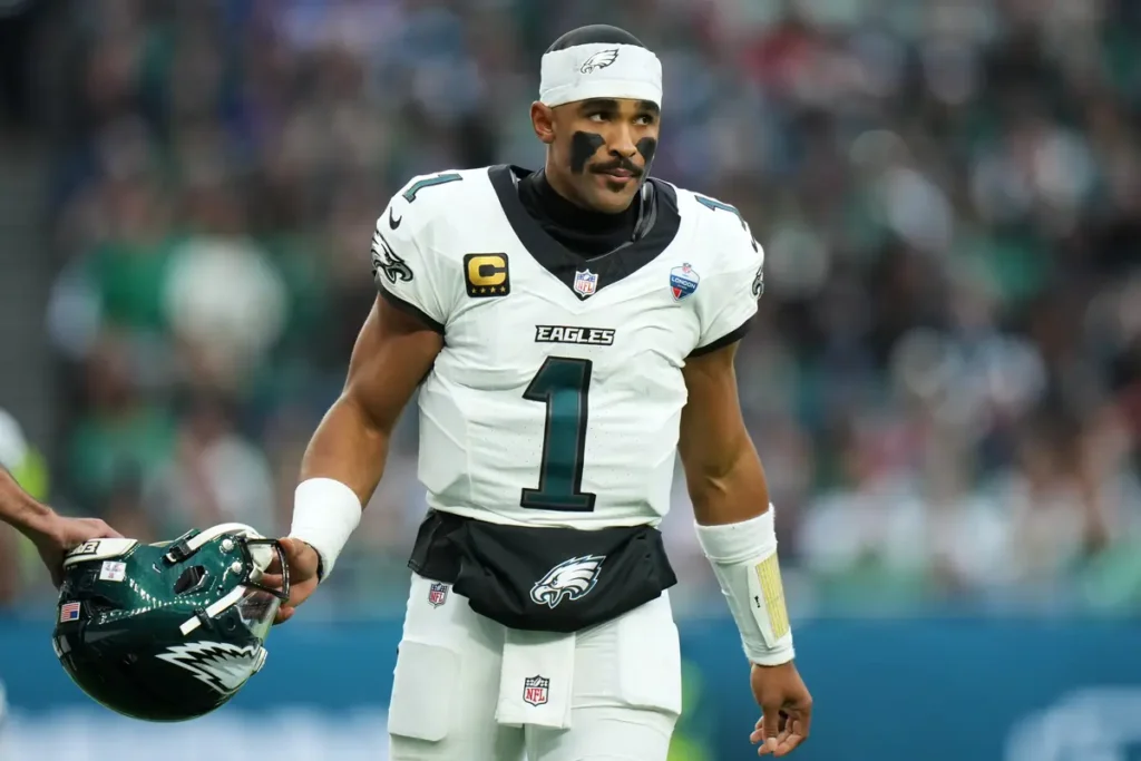 Jalen Hurts stands on the field during Philadelphia’s game against Jacksonville in London.