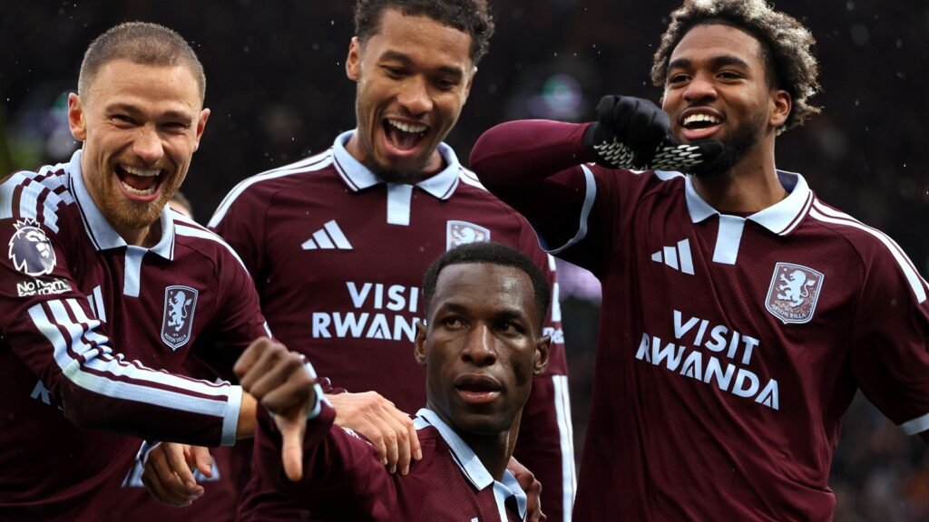 Nicolas Jackson celebrates with Aston Villa teammates.