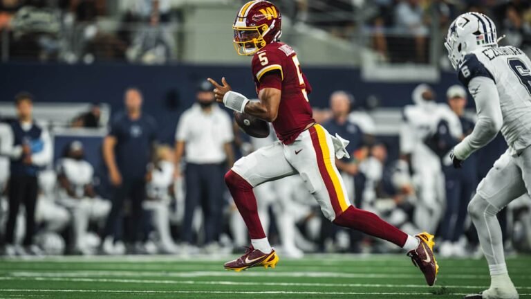 Jayden Daniels carrying the ball in a Washington uniform against Dallas