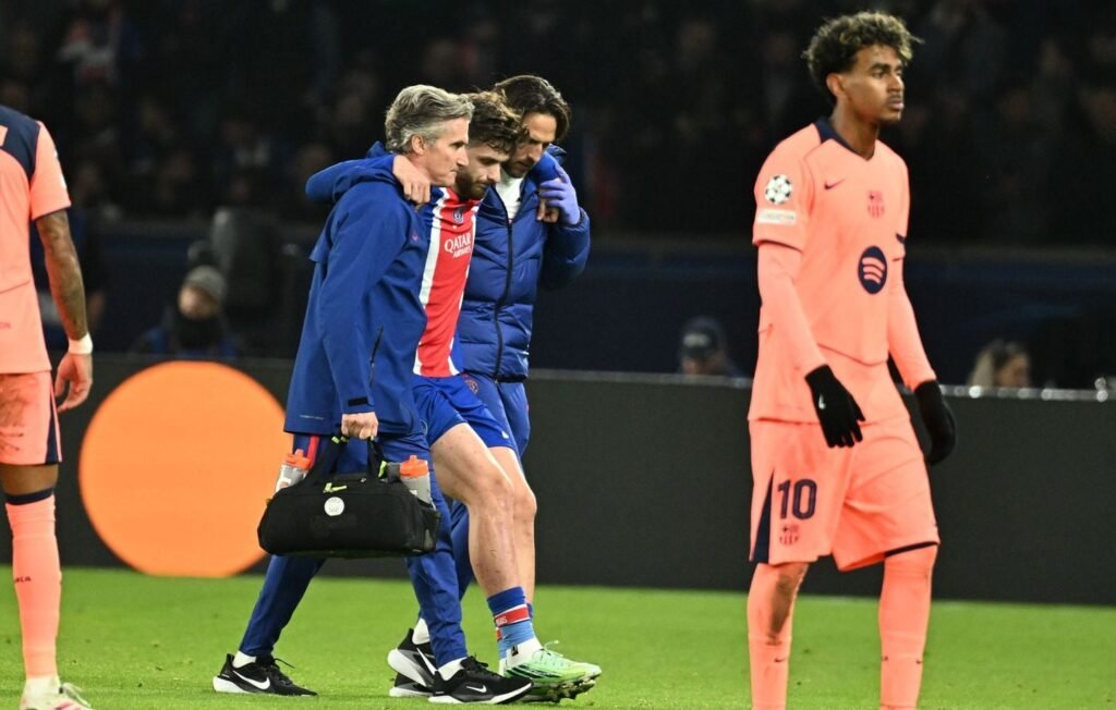 Khvicha Kvaratskhelia is helped off the field by PSG medical staff