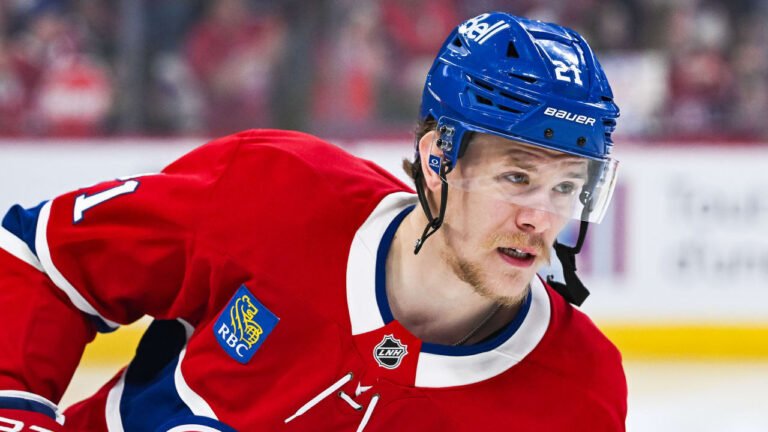 Kaiden Guhle wearing a red Montreal Canadiens jersey.