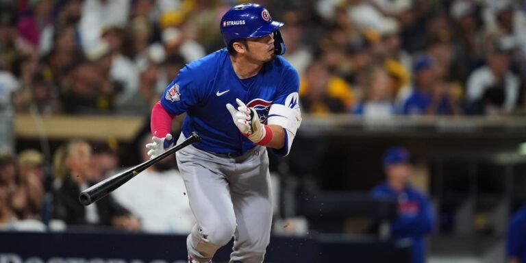 Seiya Suzuki bats in a blue Chicago Cubs jersey.