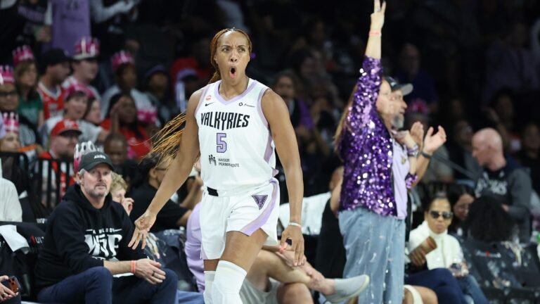 Kayla Thornton celebrates in a Golden State Valkyries uniform.