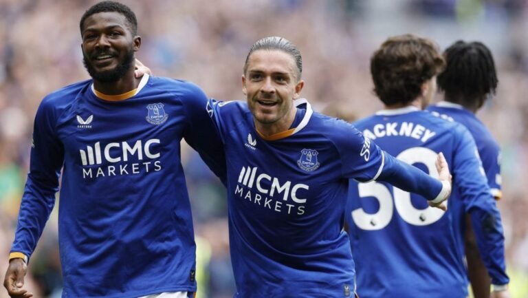 Everton players celebrate on the field.