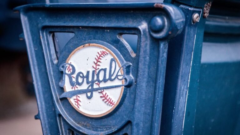 Blue seating and Royals signs at Kauffman Stadium.