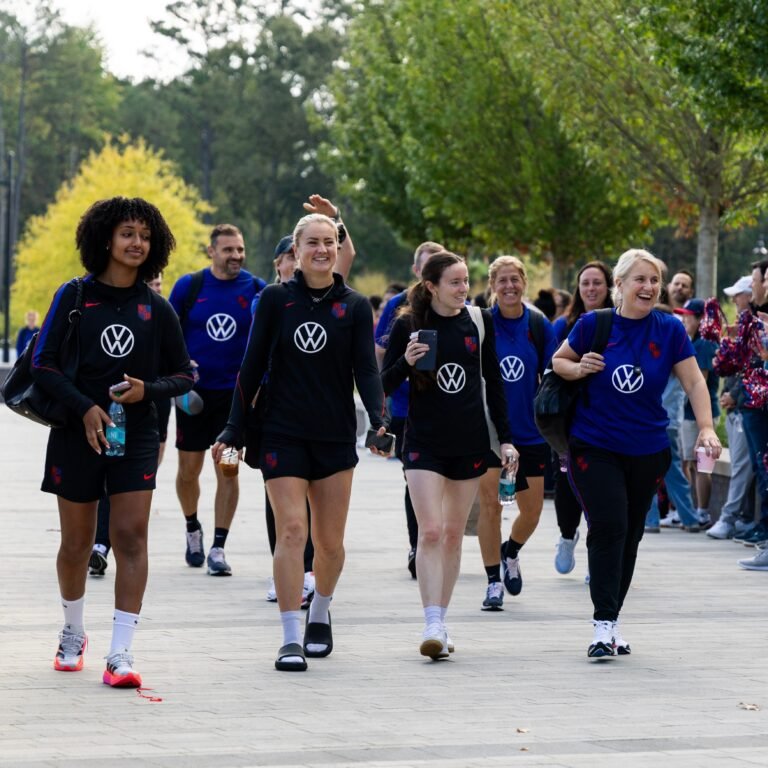 U.S. women’s national team players walk at training camp.