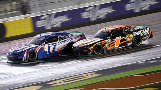 Corey Day’s No. 17 car and Carson Kvapil’s No. 1 car race side by side in Las Vegas.