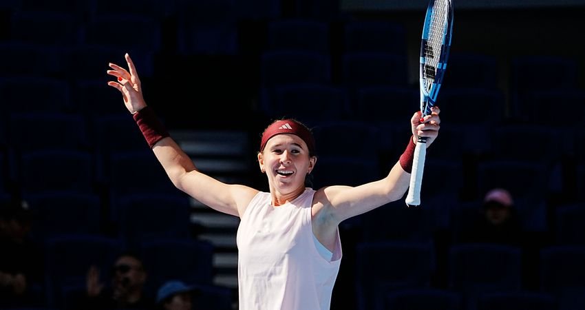 Nikola Bartunkova raises her racket and arms on court in Beijing.