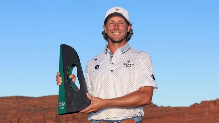 Austin Smotherman holds the tournament trophy at Black Desert Resort.
