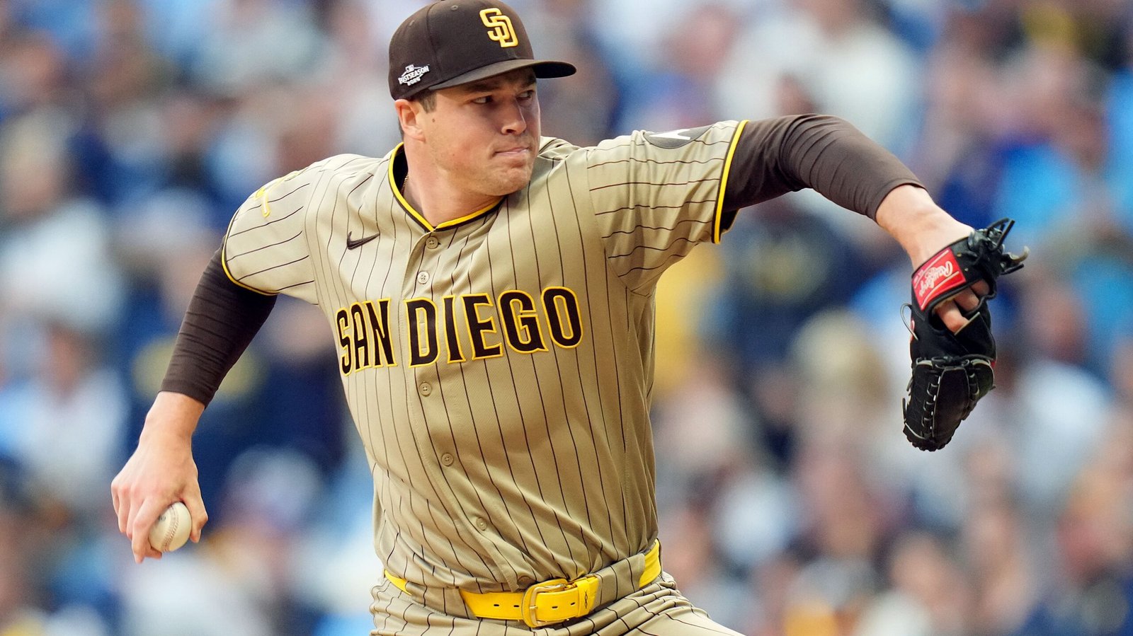 Mason Miller holds a baseball while pitching in a San Diego Padres uniform.