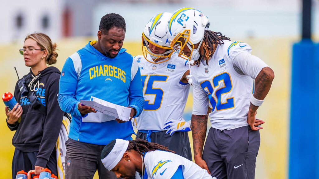 Ladd McConkey looks at a playsheet during Chargers practice.