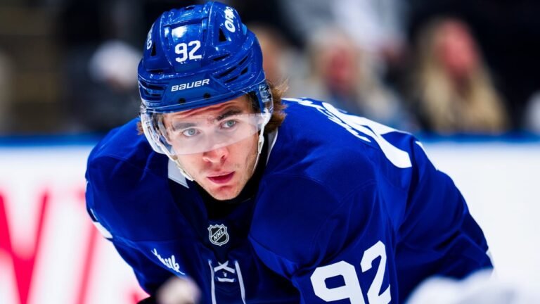 Gavin McKenna leaning forward on the ice in a blue Toronto Maple Leafs jersey