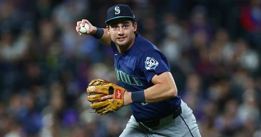 Mariners second baseman Cole Young fields a ground ball at Coors Field.